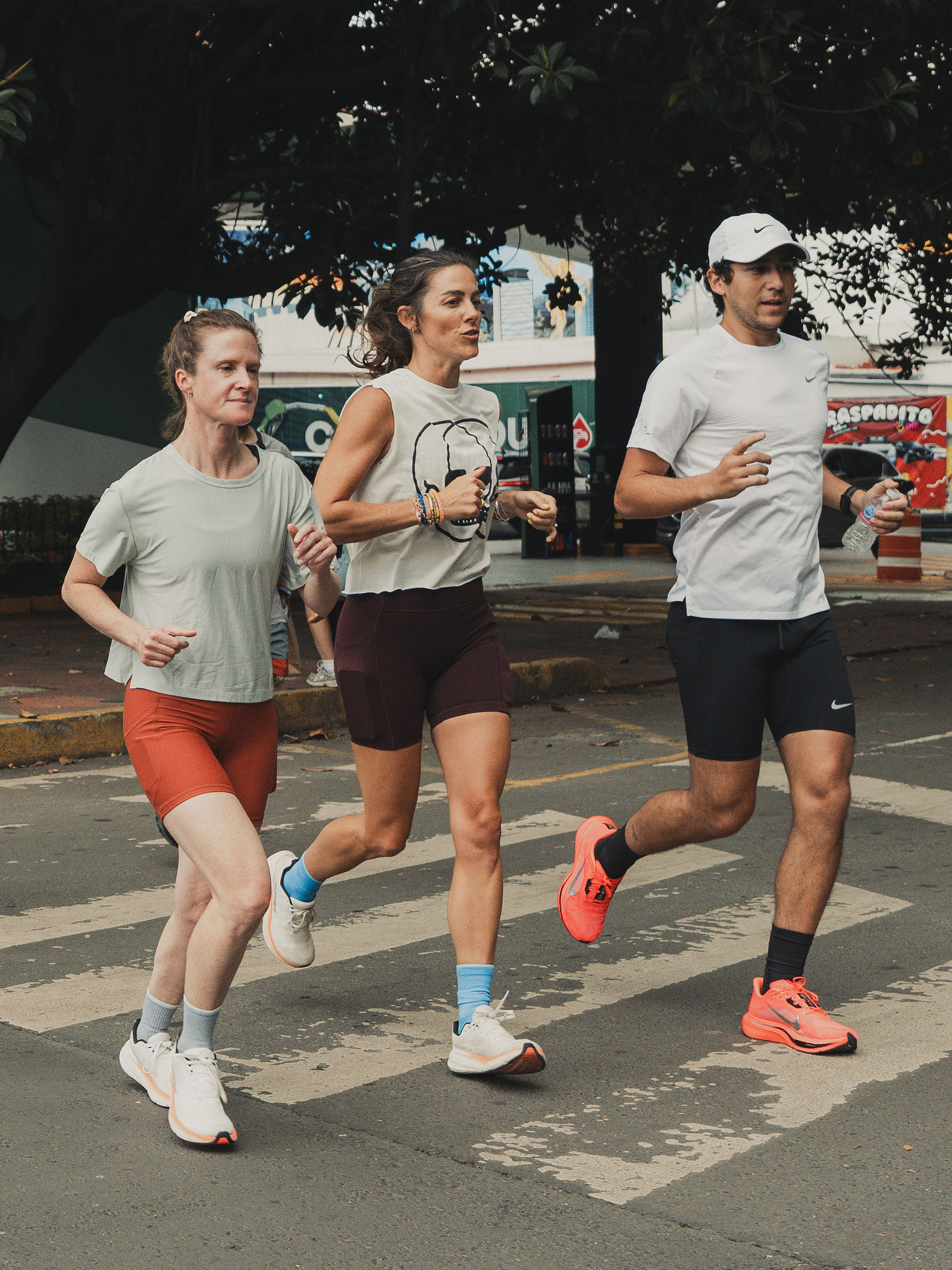Runners crossing a Mexico City street